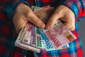 Rupiah Berpeluang Tembus Rp 16.900 per Dollar AS, Pengamat Soroti Dampak Rating MSCI dan Moody’s
